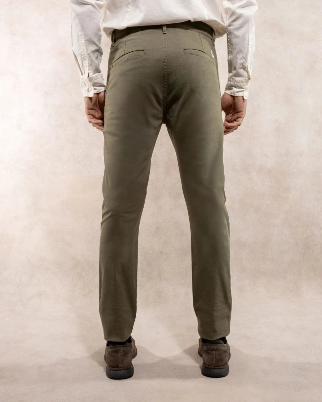 Back view of men's light green stretch chino pants by DANTE.
