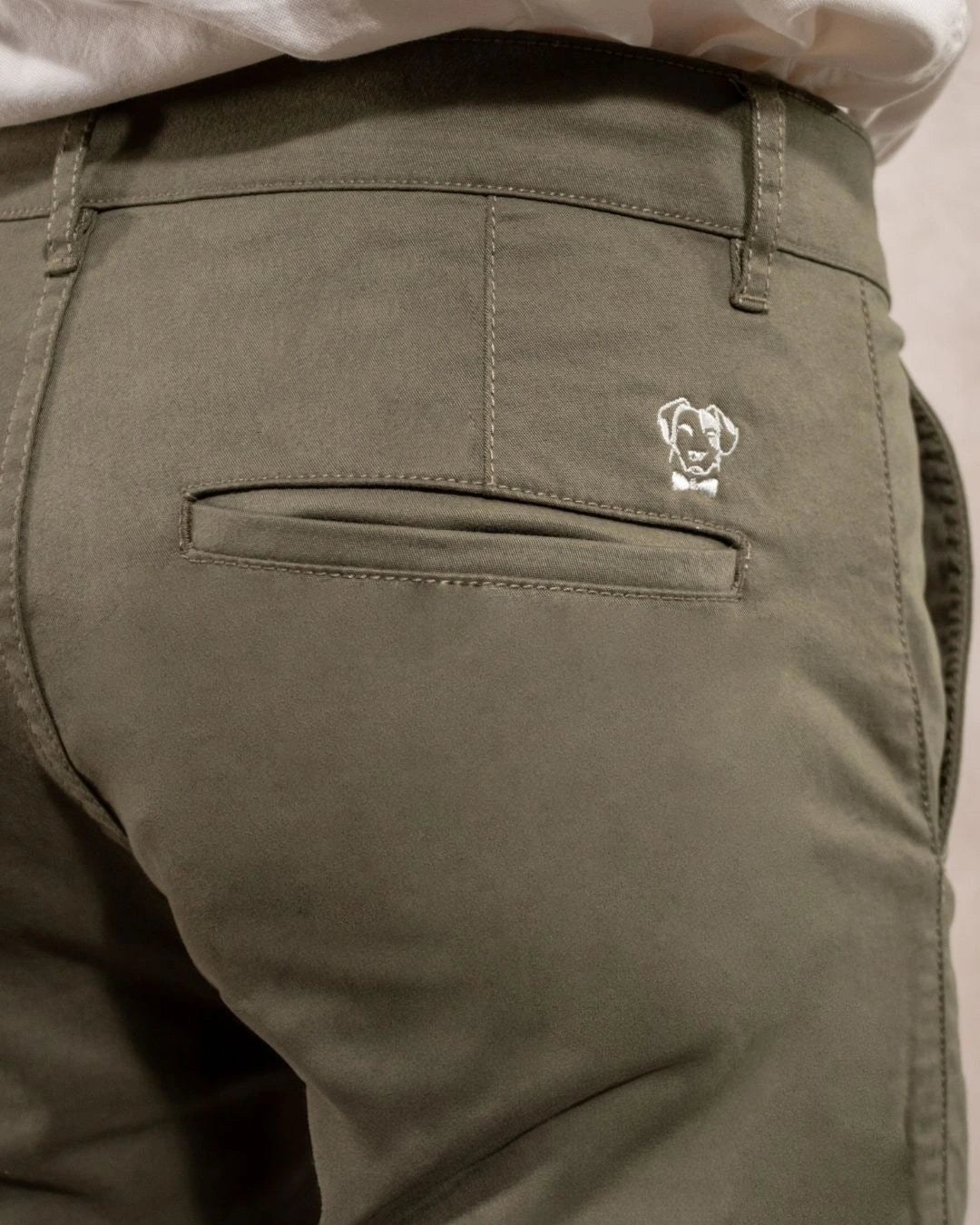 Close-up photo of men's light green -colored stretch chino pants by DANTE.