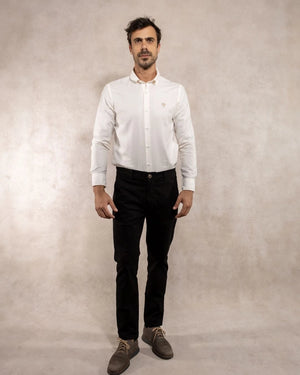 Full-body photo of men's black stretch chino pants by DANTE.